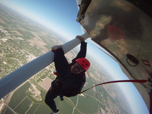 Hanging from the wing